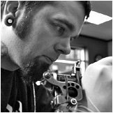 Greg Foster, co-owner and tattoo artist at Custom Tattoo