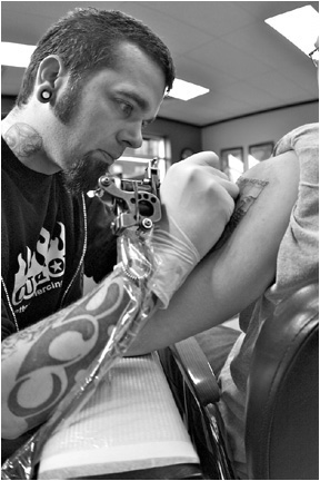 Greg Foster, co-owner and tattoo artist at Custom Tattoo, Milwaukee, Wisconsin.